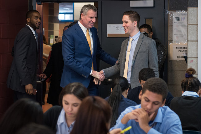 Ryan Senning shaking hands with Mayor Bill de Blasio in his classroom at the Bronx School for Law, Government, and Justice, February 2017